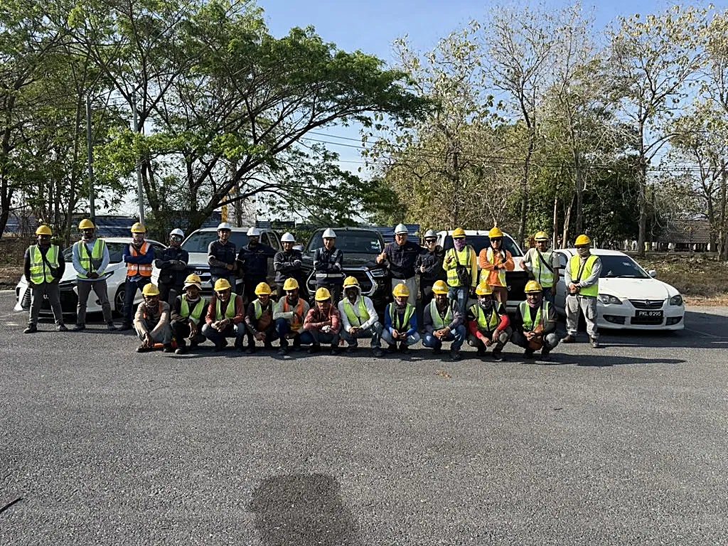 The Solar Wing crew of 25 in full safety gear with the company fleet