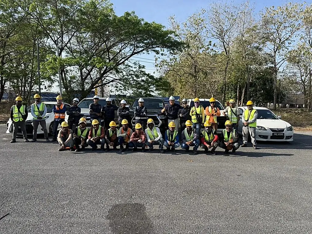 The Solar Wing crew of 25 in full safety gear with the company fleet